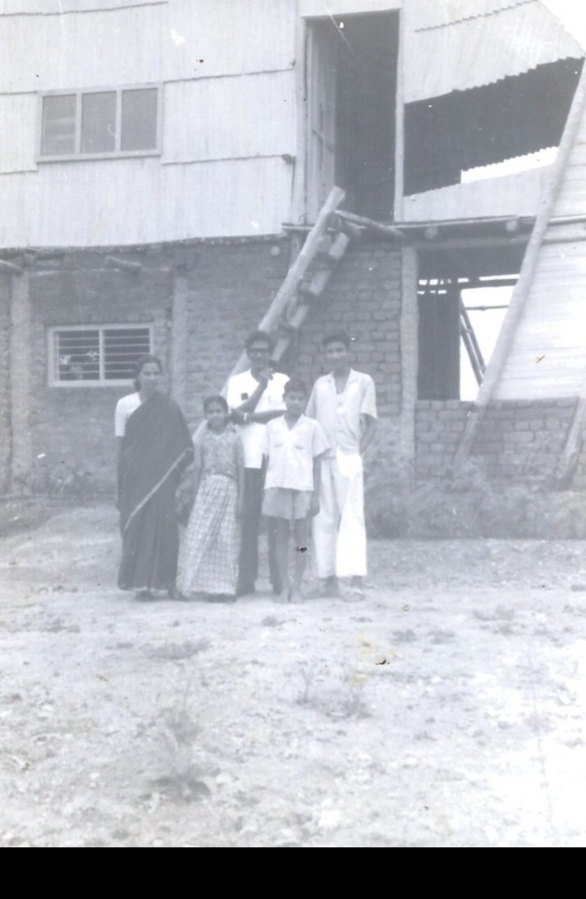 Ancha with his wife Hamsakshari and their three children outside the wooden house, Gandipet, Hyderabad