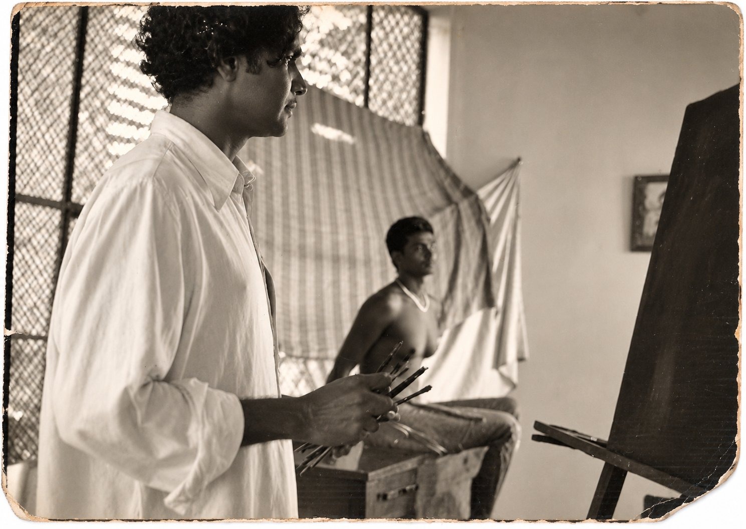 The artist painting a seated model