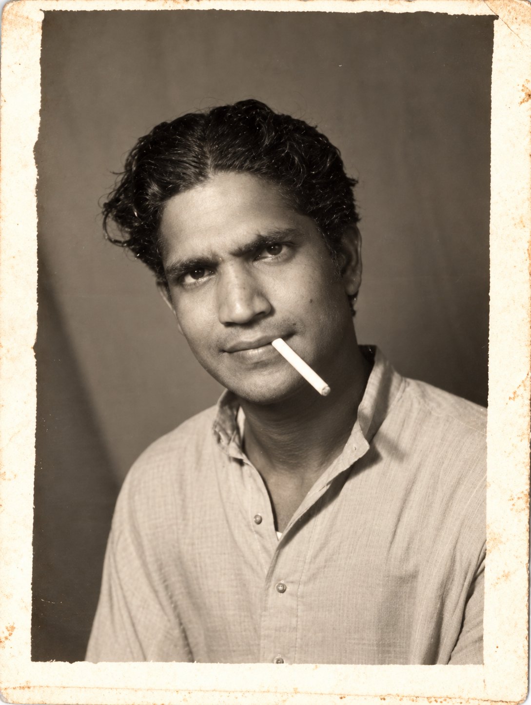 Young portrait of Ancha Radhakrishna Murthy smoking a cigarette